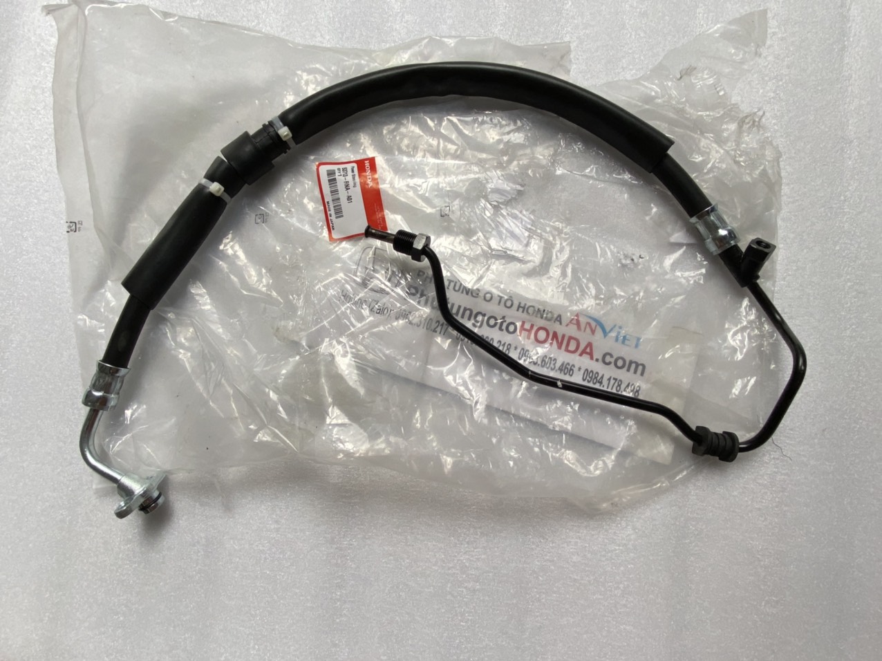 Tuy ô cao áp từ bơm trợ lực lái vào thước lái xe Honda CIVIC